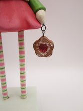 Christmas folk art snowman snow girl with fancy hat and jam sugar cookie