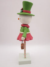 Christmas folk art snowman snow girl with fancy hat and jam sugar cookie