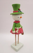Christmas folk art snowman snow girl with fancy hat and jam sugar cookie