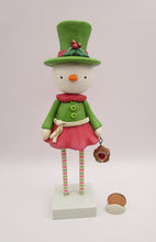 Christmas folk art snowman snow girl with fancy hat and jam sugar cookie