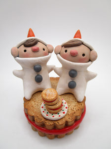 Christmas snow kids sitting on a jelly filled cookie CUTE