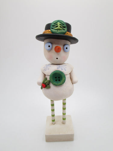 Christmas folk art snowman with black hat and wood legs