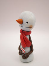 Christmas small snowman flat head and tiny gift in hand