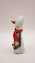 Christmas small snowman flat head and tiny gift in hand
