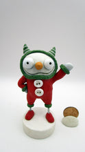 Christmas folk art sweet and creepy snowman in MONSTER costume waving hello