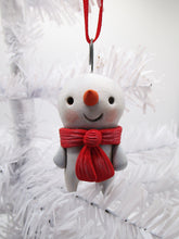 Snowman Christmas ornament with red scarf and carrot nose