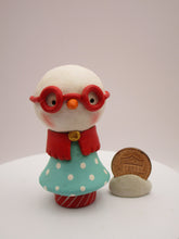 Christmas folk art small snowman snowgirl with red glasses a bit cheeky