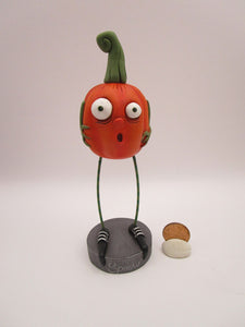 Halloween folk art scared spooky pumpkin with long legs