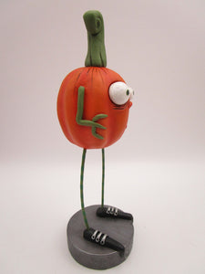 Halloween folk art scared spooky pumpkin with long legs
