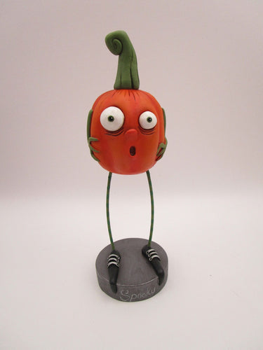 Halloween folk art scared spooky pumpkin with long legs