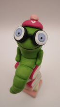 Valentine folk art little bookworm with glasses on stack of famous books