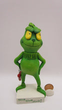Christmas folk art grinch like standing character with heart charm