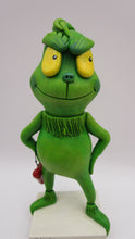 Christmas folk art grinch like standing character with heart charm