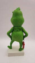 Christmas folk art grinch like standing character with heart charm