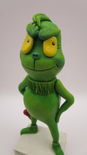 Christmas folk art grinch like standing character with heart charm
