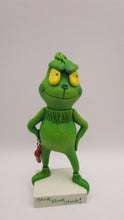 Christmas folk art grinch like standing character with heart charm