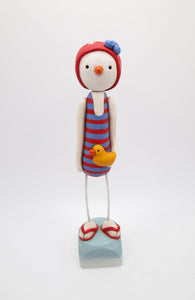 Summer time 4th of July snowman wearing vintage style swimsuit and swim cap and ducky
