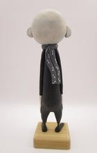 Halloween folk art spooky swirl eye character in skeleton suit