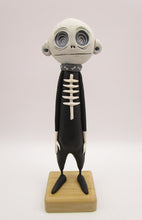 Halloween folk art spooky swirl eye character in skeleton suit