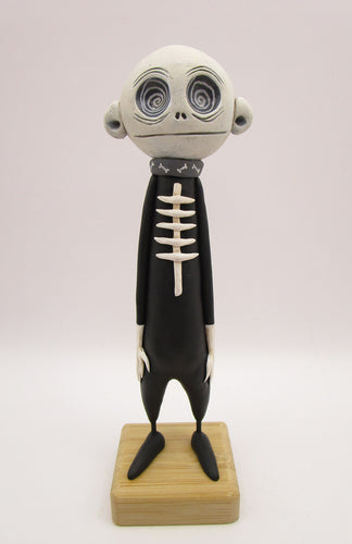 Halloween folk art spooky swirl eye character in skeleton suit