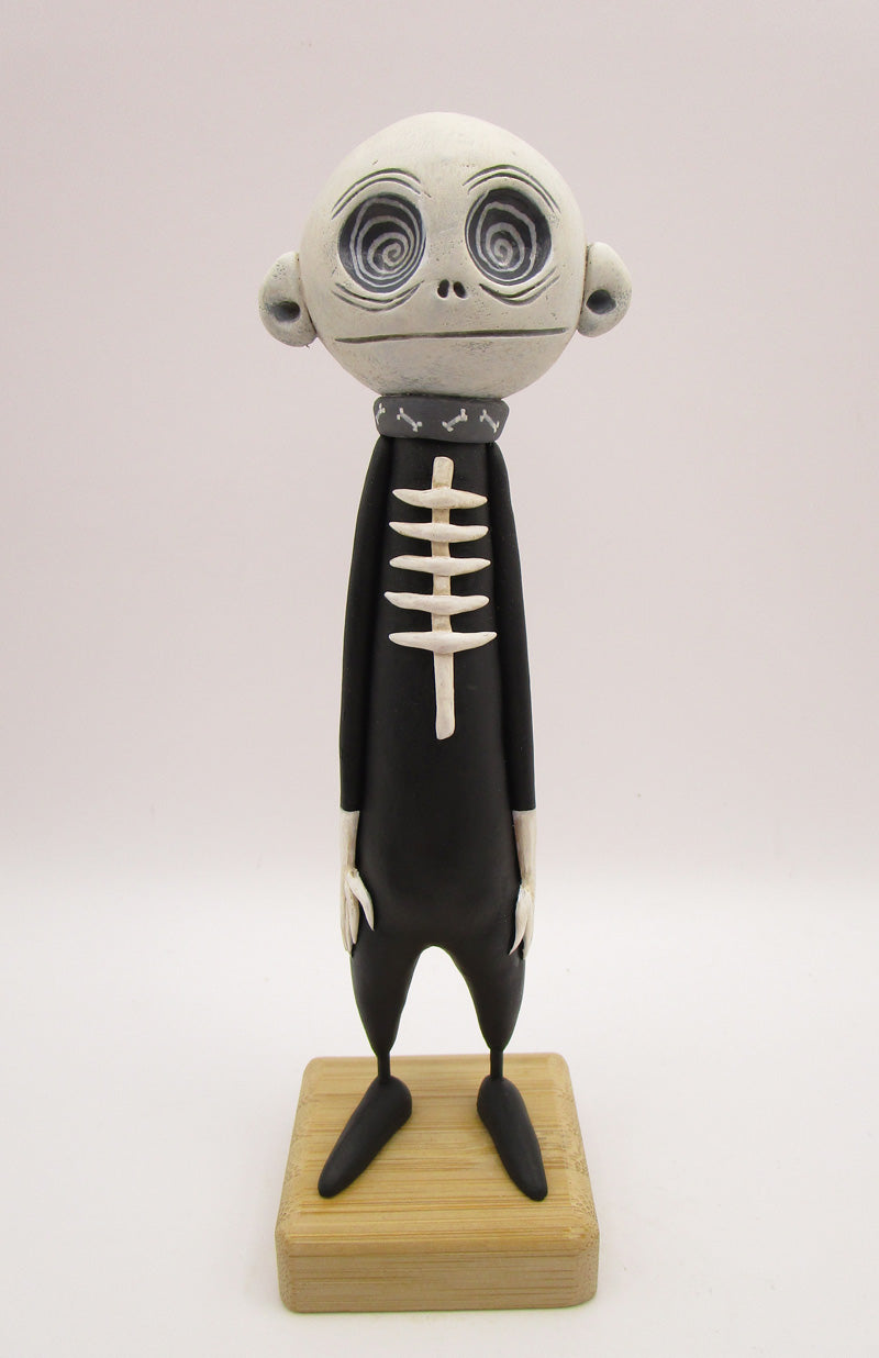Halloween folk art spooky swirl eye character in skeleton suit
