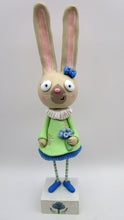 Tall Spring folk art or Easter rabbit wearing flower dress