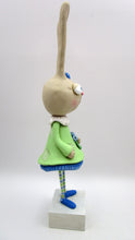 Tall Spring folk art or Easter rabbit wearing flower dress