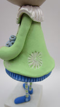 Tall Spring folk art or Easter rabbit wearing flower dress