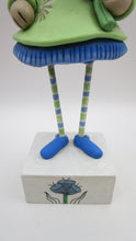 Tall Spring folk art or Easter rabbit wearing flower dress