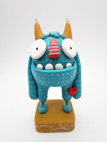 Monster TEAL painted monster with horns and love emblem