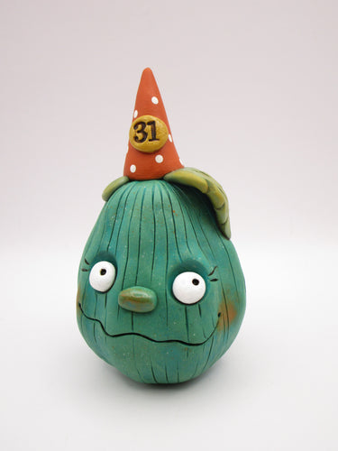 Halloween pumpkin character in teal with 31 hat