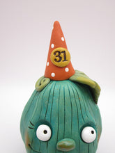 Halloween pumpkin character in teal with 31 hat