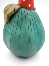 Halloween pumpkin character in teal with 31 hat