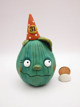 Halloween pumpkin character in teal with 31 hat