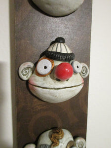 Wacky character wall plaque with three character heads - misc