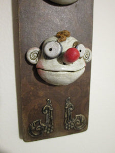 Wacky character wall plaque with three character heads - misc