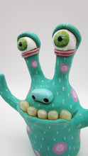 Monster folk art with realistic "teeth"