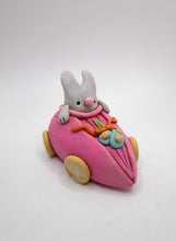 Easter Spring folk art bunny riding in pink tulip car