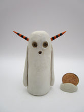 Halloween folk art spooky ghost with orange and black horns