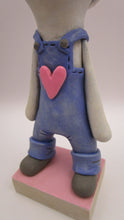 Valentine folk art snowman wearing "denim" like overalls