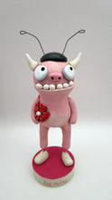 Valentine folk art monster dressed in lady bug costume