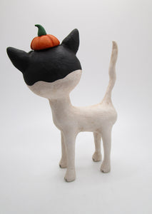 Halloween folk art black and mostly white cat with pumpkin hat