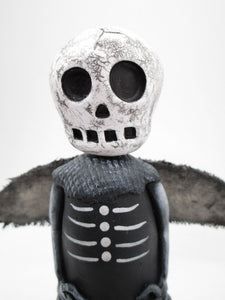 Dark Halloween Skeleton man with wings and crackled skull