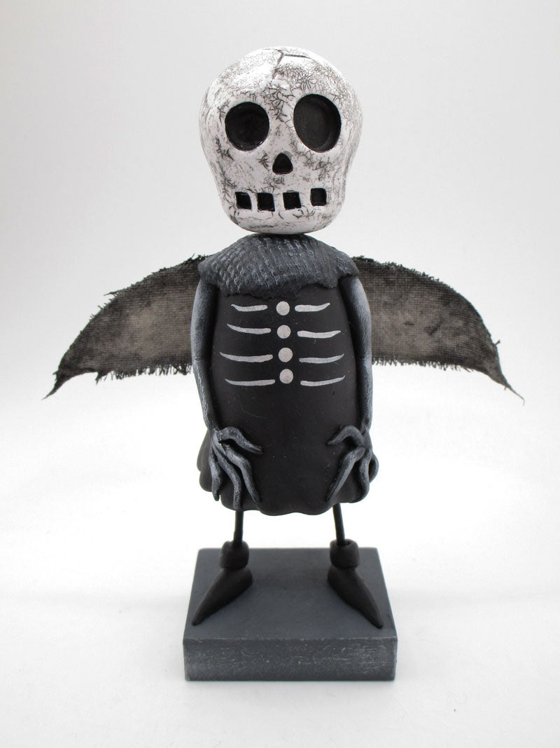 Dark Halloween Skeleton man with wings and crackled skull