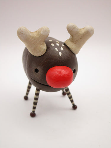 Christmas folk art small reindeer character with wood legs