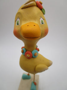 Folk art Easter DUCK with flower collar and painted eyes