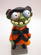 Halloween folk art GIRL zombie with hair buns and cotton spun charm