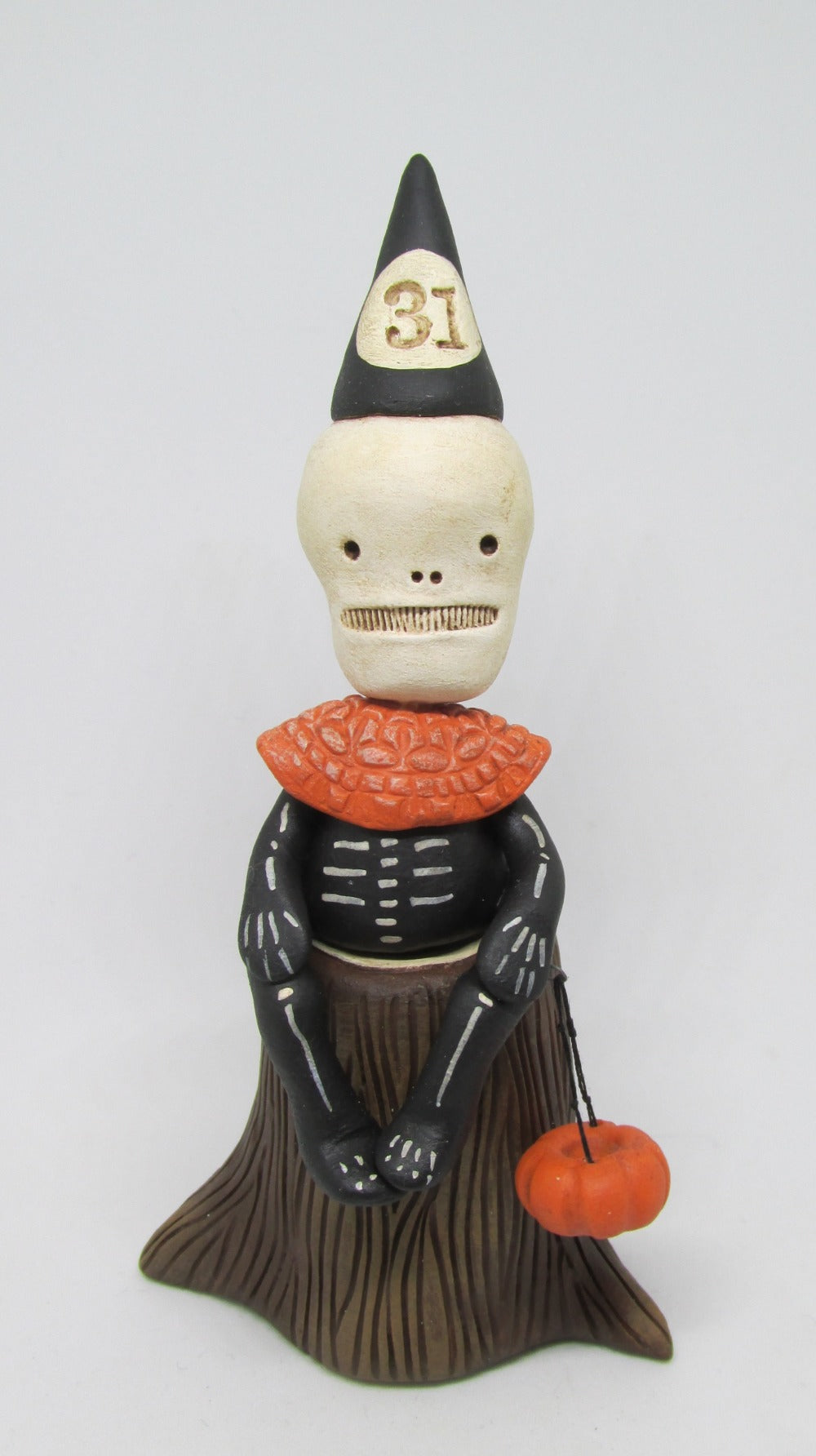 Halloween 31 Skelly Skeleton sitting on stump - trick or treater style