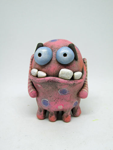 Pink 9 legged monster with extra big teeth and eyes misc