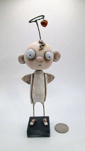 Sad yet sweet angel with twisted wire halo and charm - paper clay